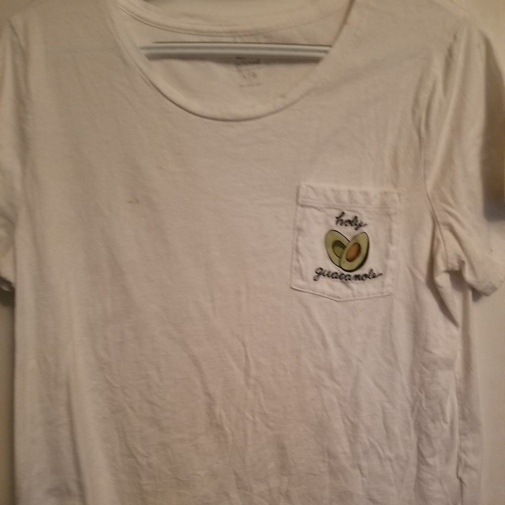 A white T-shirt that says "Holy guacamole "